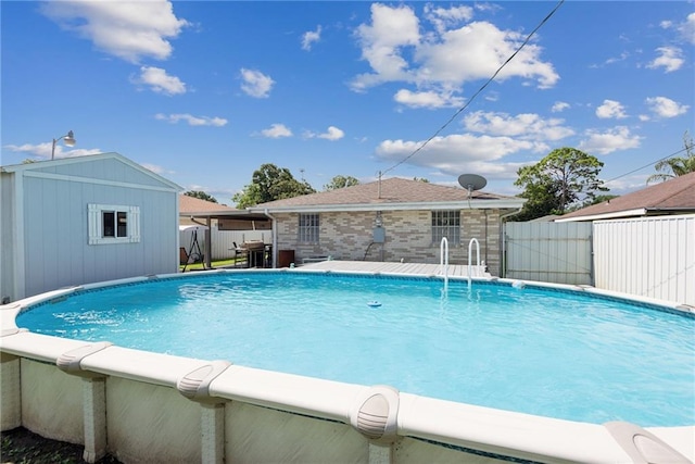 view of swimming pool with an outdoor structure