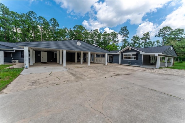 single story home featuring a carport