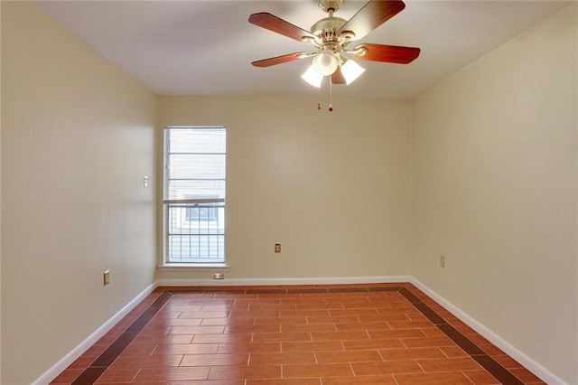 empty room with ceiling fan and a healthy amount of sunlight