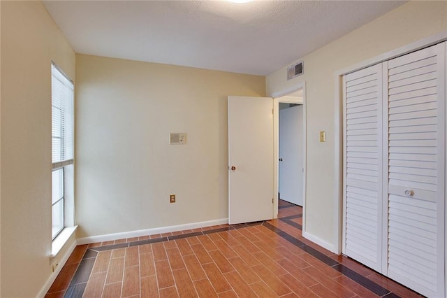 unfurnished bedroom featuring a closet