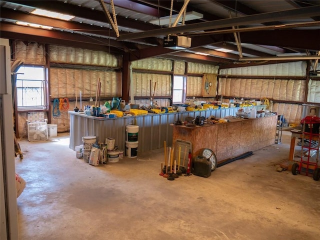 garage featuring a workshop area and a garage door opener