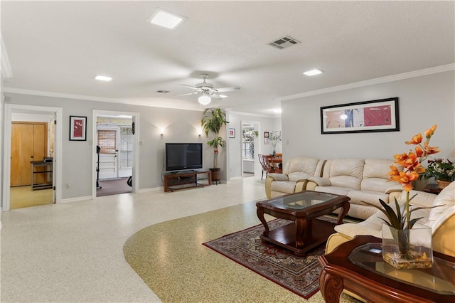 living room with ceiling fan and crown molding