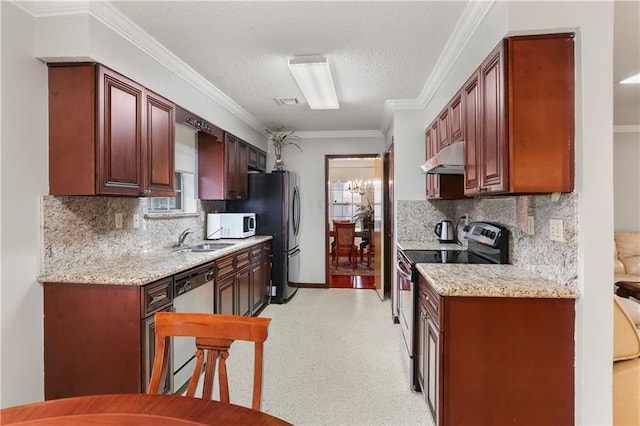 kitchen with light stone counters, under cabinet range hood, a sink, ornamental molding, and appliances with stainless steel finishes