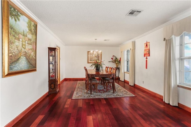 dining area with dark wood-type flooring, visible vents, crown molding, and a textured ceiling