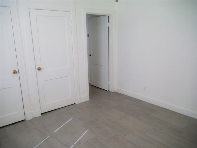 unfurnished bedroom with a closet