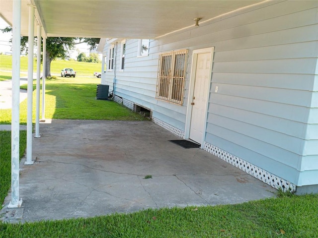 view of patio / terrace featuring a carport and cooling unit