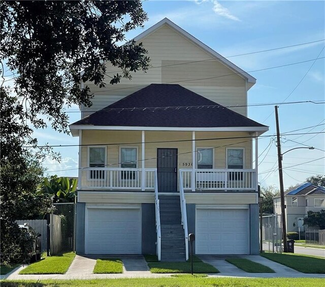 view of front of house with a garage and covered porch