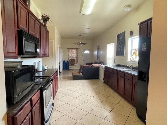 kitchen featuring light tile patterned flooring, sink, ceiling fan, and black appliances