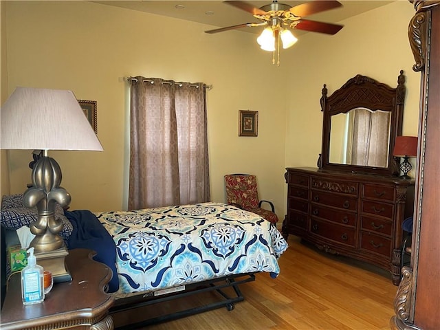 bedroom featuring ceiling fan and light wood-type flooring