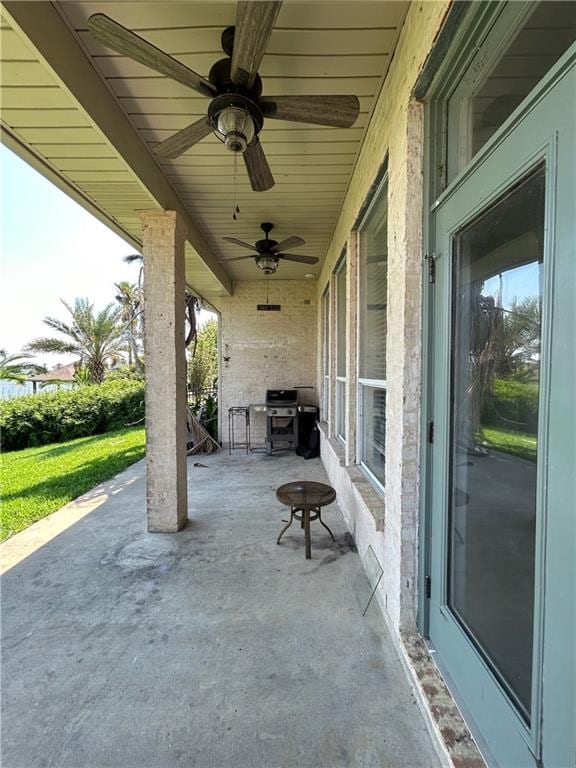 view of patio featuring area for grilling and ceiling fan