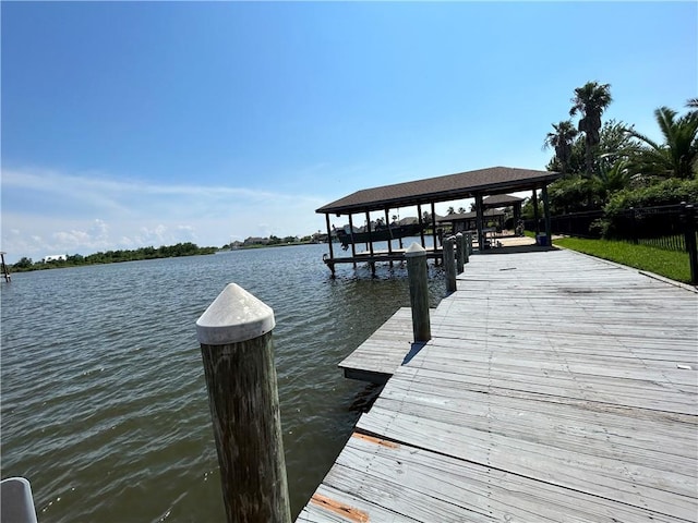 dock area with a water view