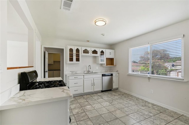 3528 Tulane Dr, Kenner, LA 70065 - kitchen with dishwasher, gas range oven, white cabinetry, a sink, and glass insert cabinets