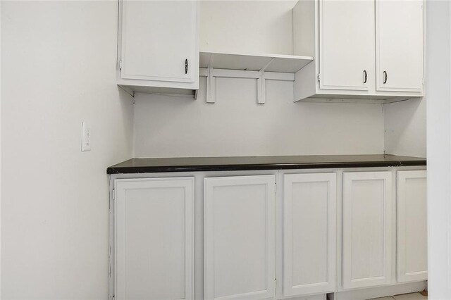 3528 Tulane Dr, Kenner, LA 70065 - kitchen with white cabinets, dark countertops, and open shelves