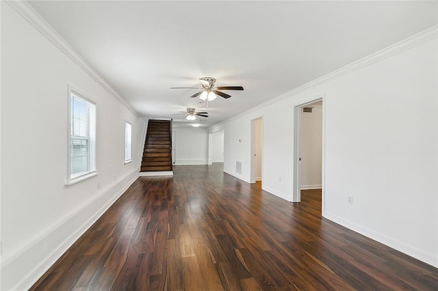 unfurnished living room with ceiling fan, dark wood-type flooring, and ornamental molding