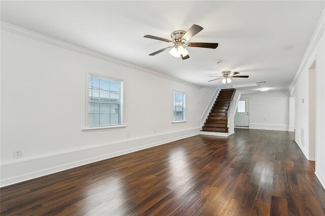 empty room with dark hardwood / wood-style floors, ceiling fan, and crown molding