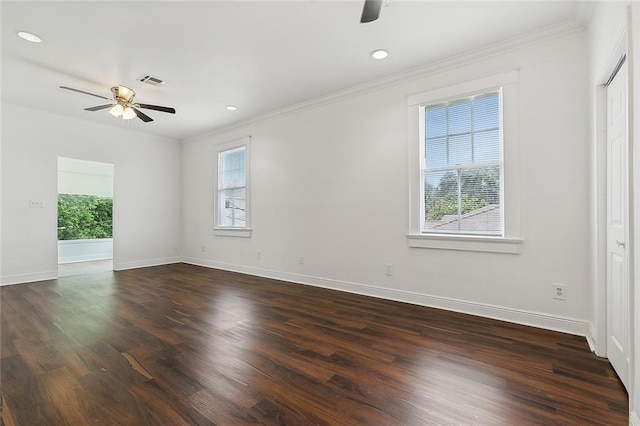 unfurnished room featuring ceiling fan, dark hardwood / wood-style flooring, and crown molding