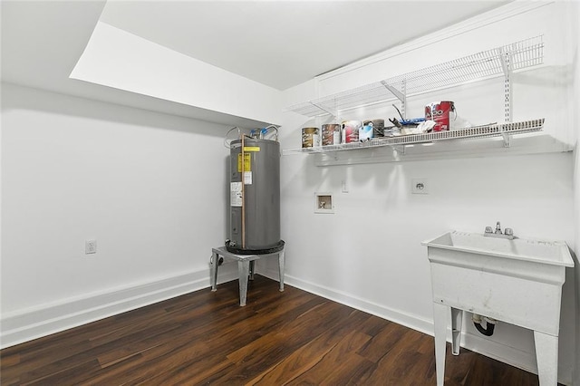 laundry room featuring sink, dark wood-type flooring, electric dryer hookup, water heater, and hookup for a washing machine