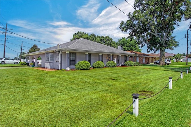 single story home featuring a front lawn