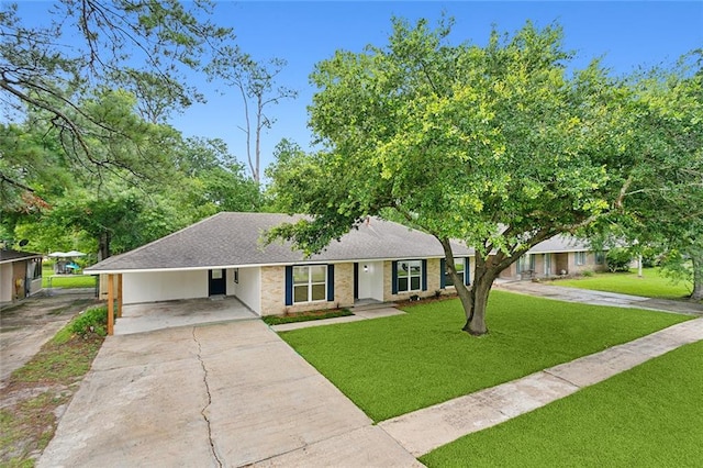 ranch-style house with a carport and a front lawn