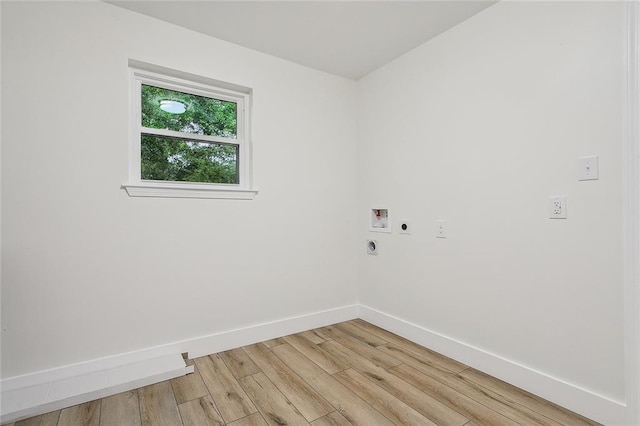 laundry room with hookup for a washing machine, light hardwood / wood-style floors, and electric dryer hookup