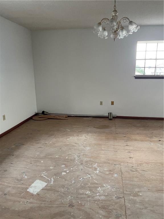 empty room featuring a notable chandelier