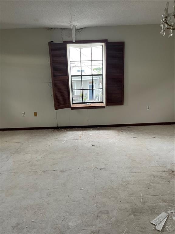 empty room with a textured ceiling