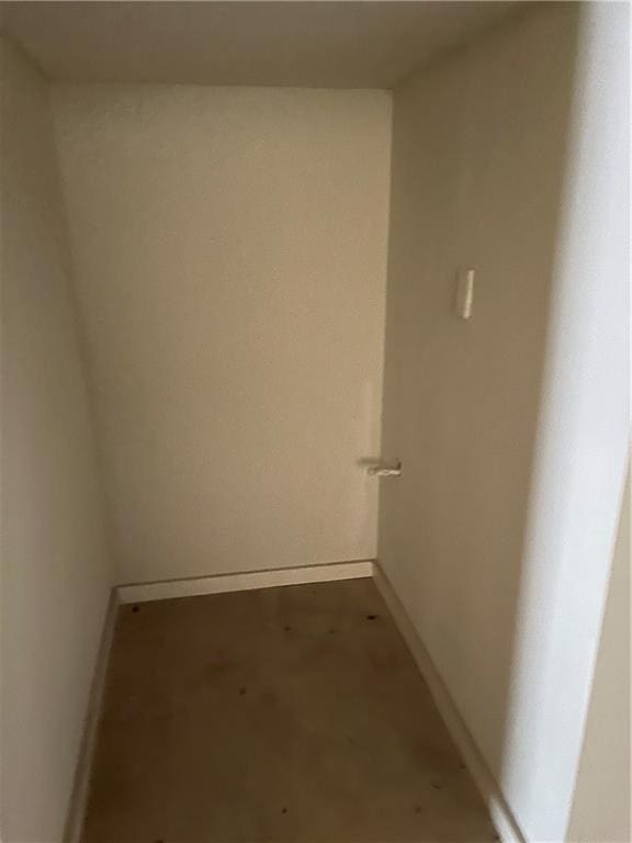 spare room featuring concrete flooring