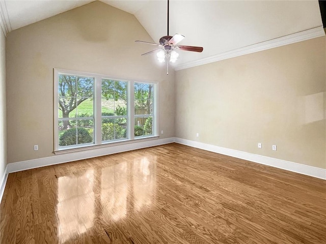 unfurnished room featuring hardwood / wood-style floors, crown molding, ceiling fan, and lofted ceiling