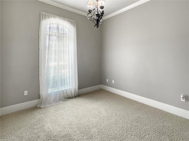 spare room featuring carpet, an inviting chandelier, and crown molding