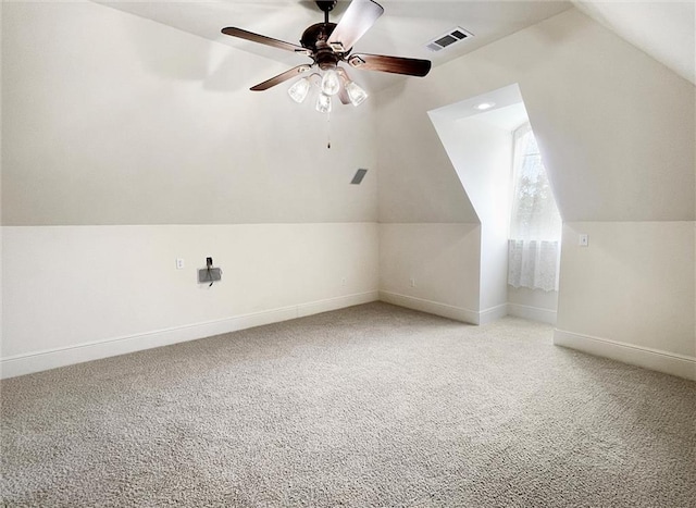 bonus room featuring ceiling fan, light colored carpet, and vaulted ceiling