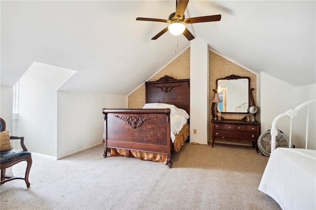 carpeted bedroom with vaulted ceiling, ceiling fan, and brick wall