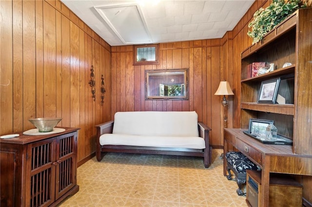 living area with wood walls