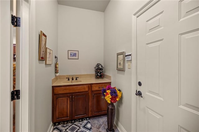 bathroom featuring tile patterned flooring and vanity