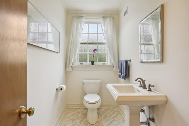 bathroom featuring tile patterned floors and toilet