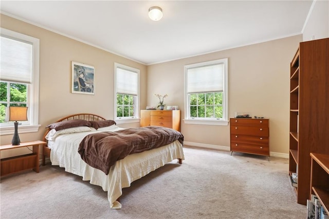 bedroom featuring carpet floors and crown molding