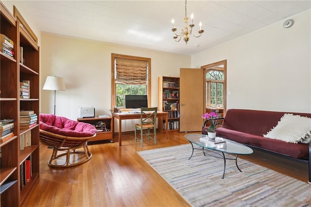 living room featuring hardwood / wood-style floors and a notable chandelier