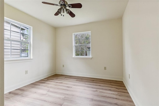 unfurnished room featuring ceiling fan and light wood-type flooring