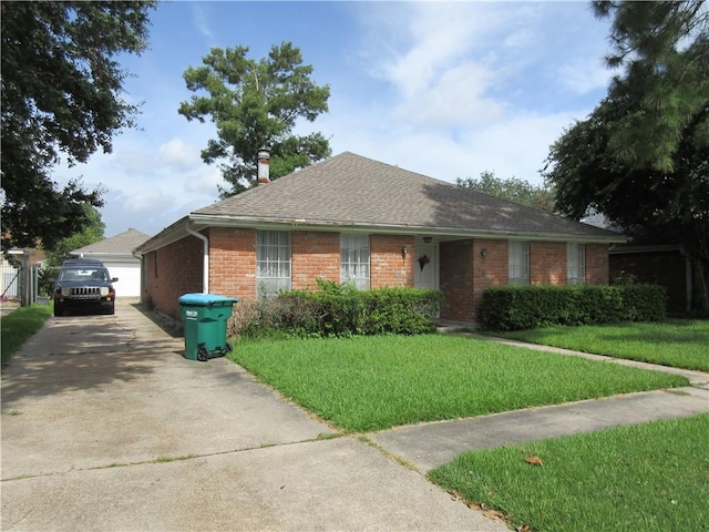 ranch-style home featuring a front yard