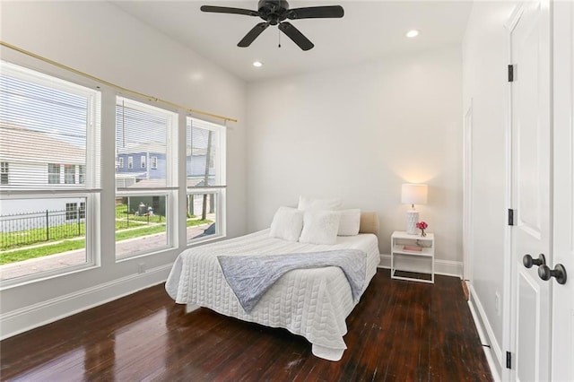 bedroom with ceiling fan and hardwood / wood-style flooring