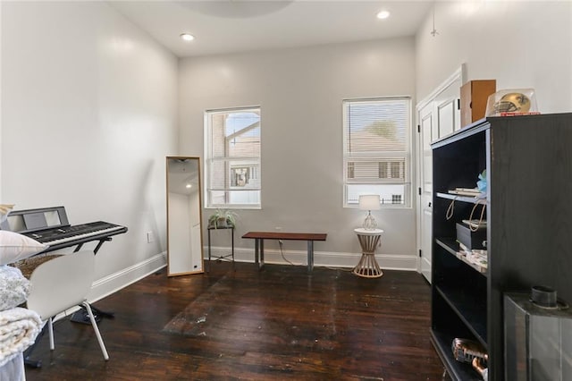 office with dark hardwood / wood-style floors