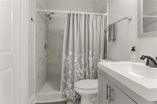 bathroom with vanity, toilet, and walk in shower