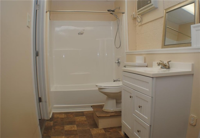 full bathroom with washtub / shower combination, a wall mounted air conditioner, vanity, and toilet