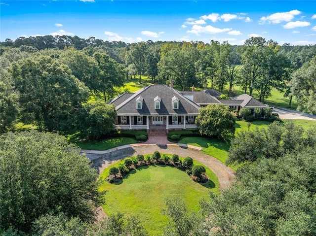 bird's eye view featuring a wooded view