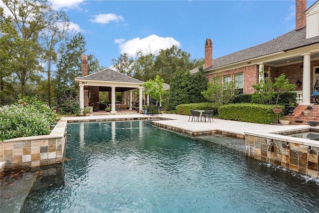 view of swimming pool featuring a gazebo and a patio