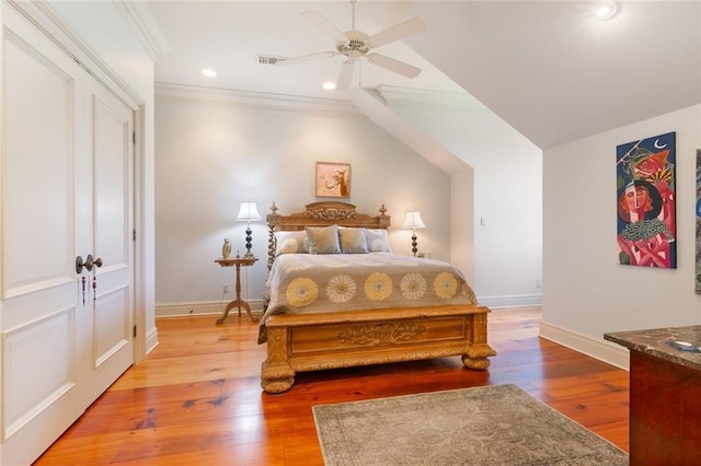 bedroom featuring baseboards, visible vents, recessed lighting, ornamental molding, and light wood-type flooring