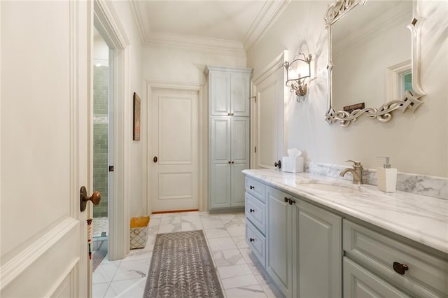 bathroom with marble finish floor, ornamental molding, and vanity