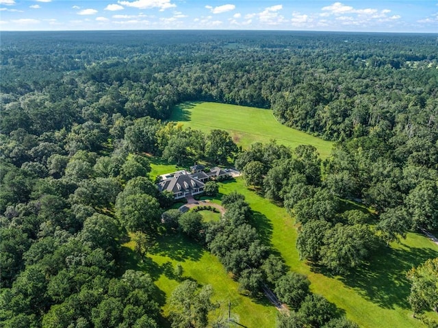 aerial view featuring a wooded view