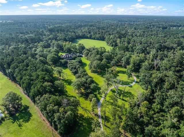 birds eye view of property with a wooded view