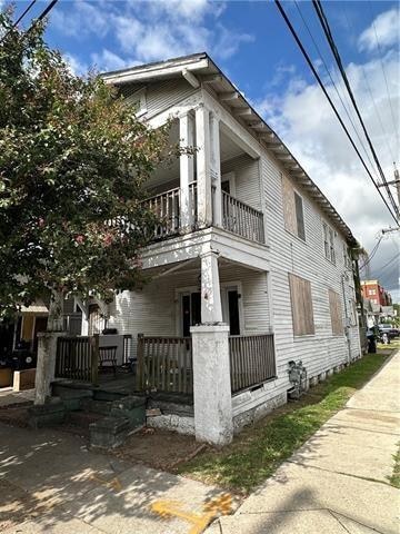 view of home's exterior with a balcony