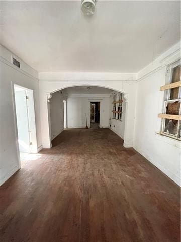 unfurnished living room featuring dark wood-type flooring